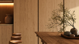 Chic and modern kitchen dining area illuminated by designer lamp, featuring wooden chairs and a table in a tastefully decorated space, 3d rendering