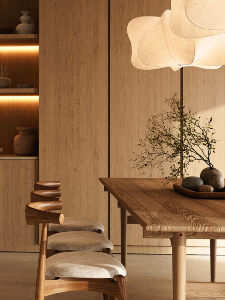 Chic and modern kitchen dining area illuminated by designer lamp, featuring wooden chairs and a table in a tastefully decorated space, 3d rendering